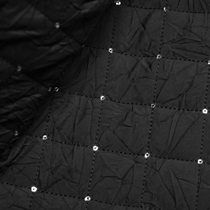 Tissu matelassé en polyester avec paillettes | Noir | Deadstock de designer