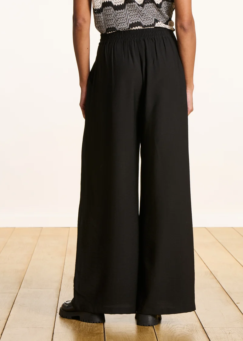 Pantalon large noir en jacquard