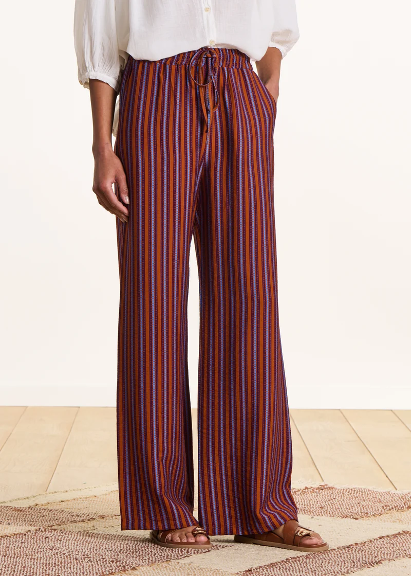 Pantalon large violet et orange rayé