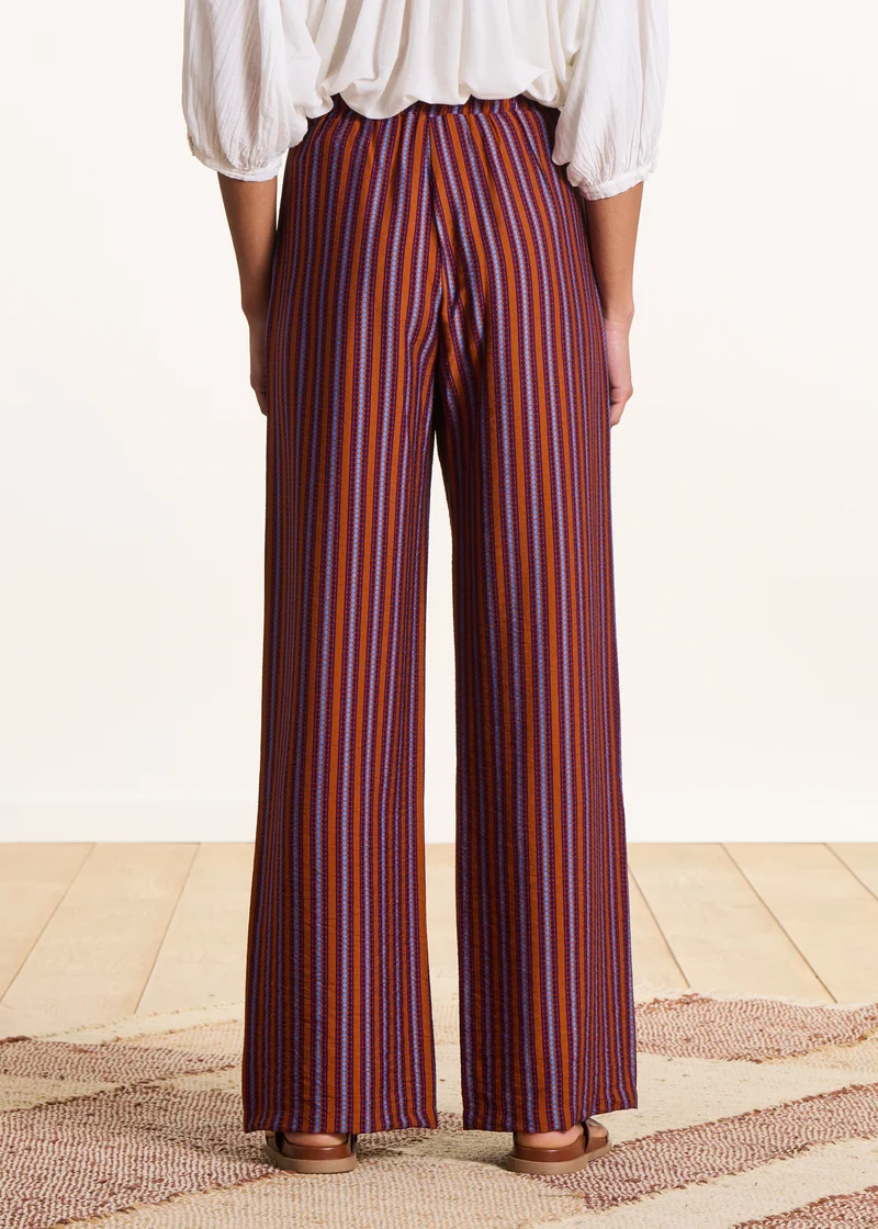 Pantalon large violet et orange rayé