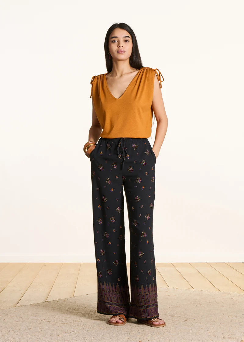 Pantalon large noir à imprimé