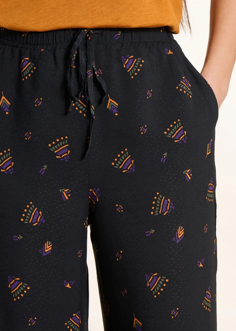 Pantalon large noir à imprimé