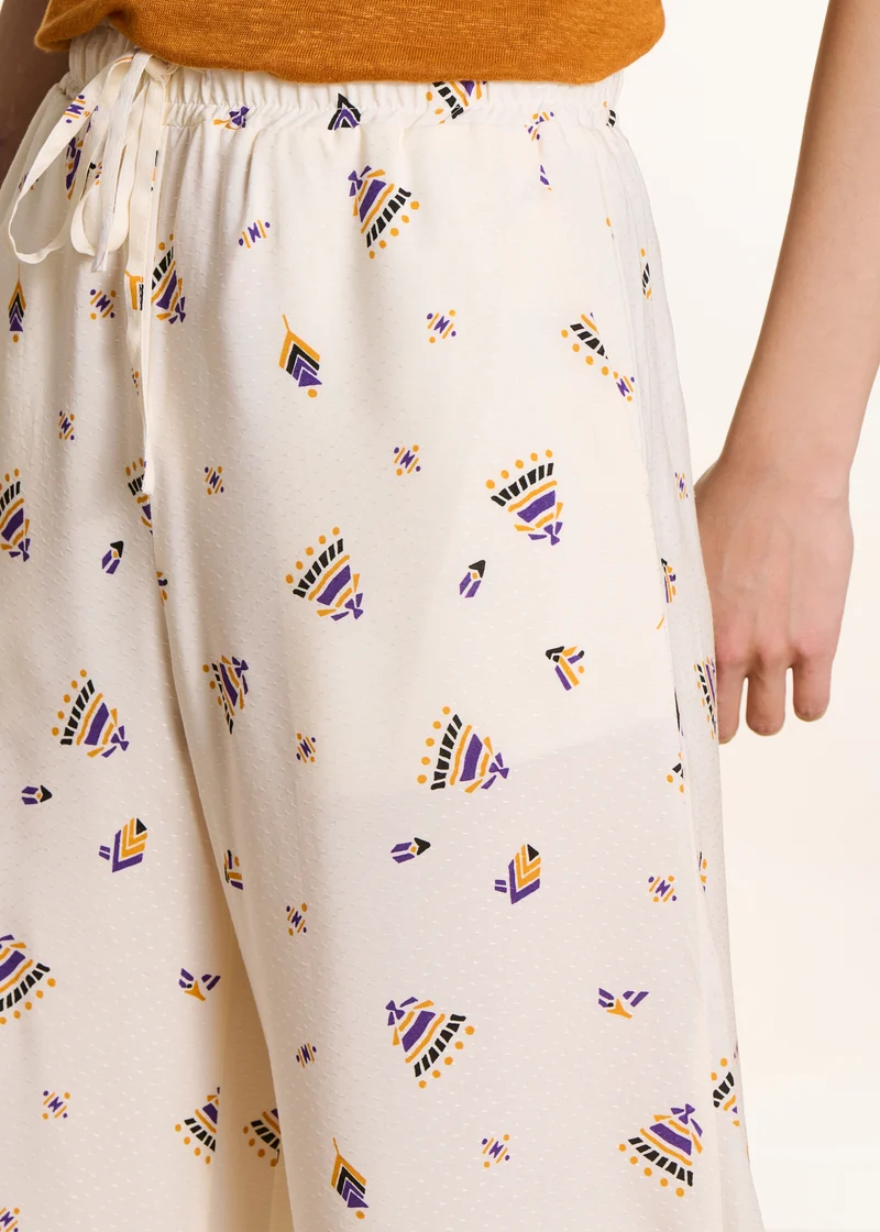 Pantalon large écru à imprimé
