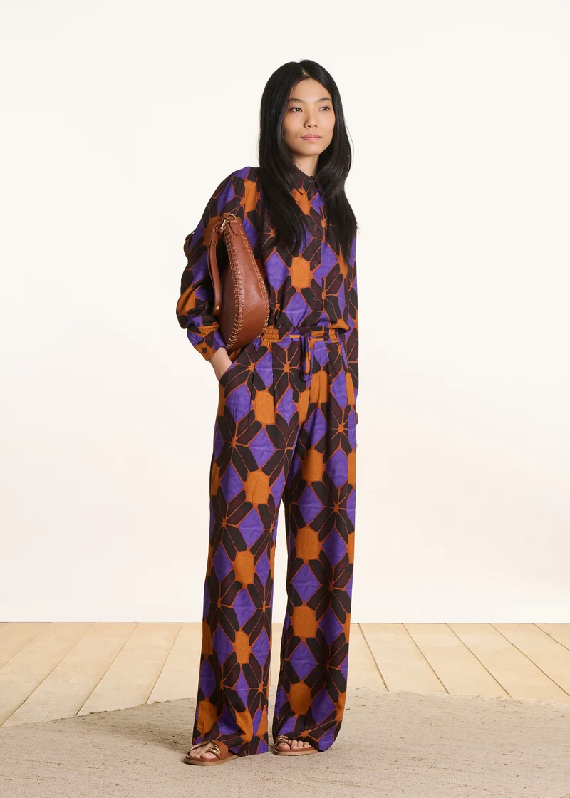 Pantalon large orange et violet à imprimé