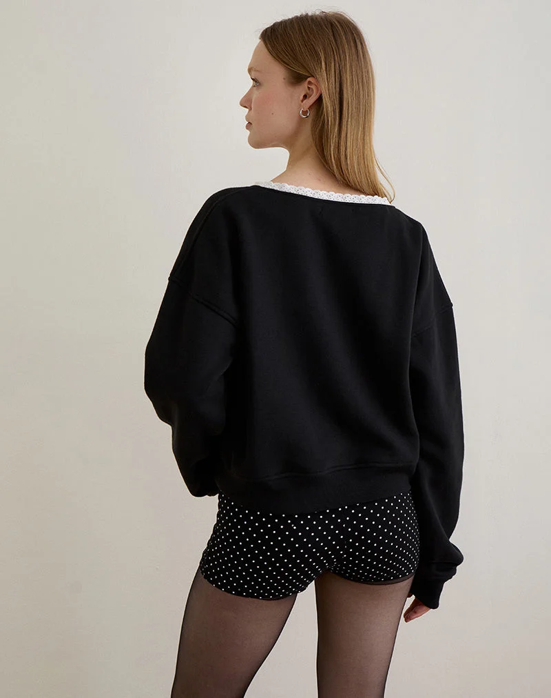 Pull Rodyn en noir avec des pointillés blancs