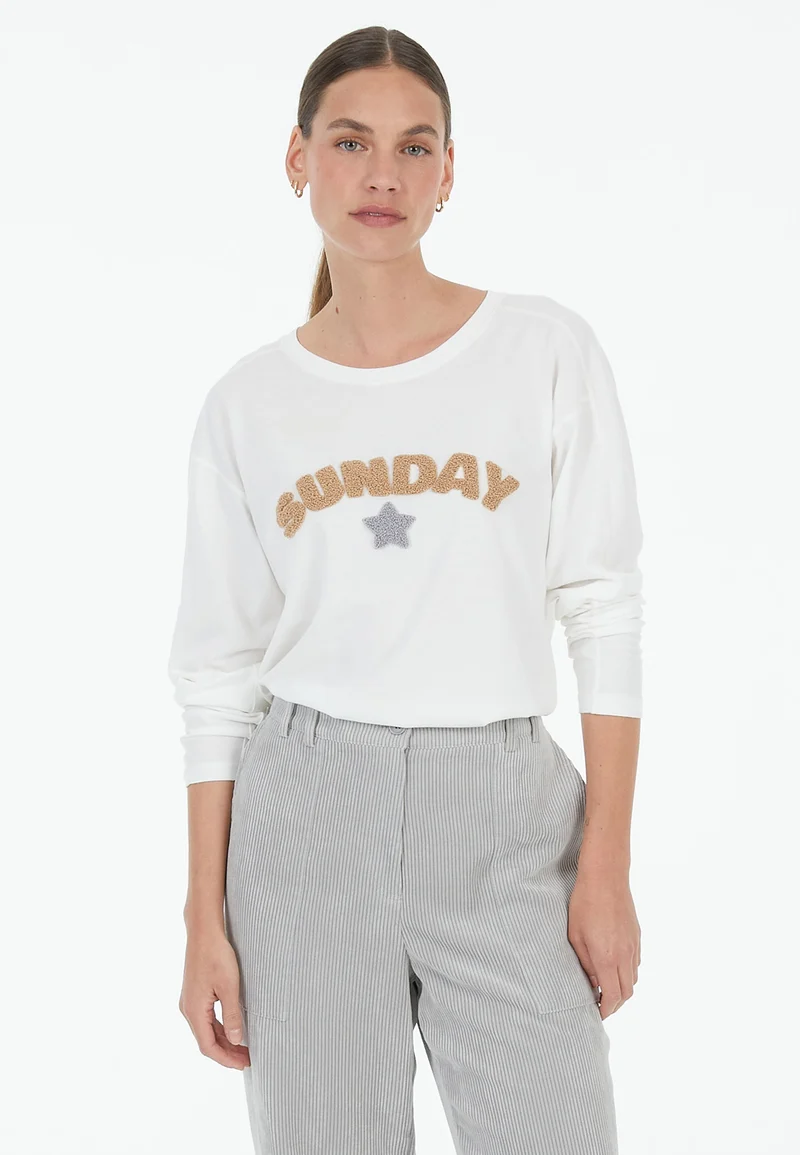 T-shirt à manches longues avec inscription en bouclé