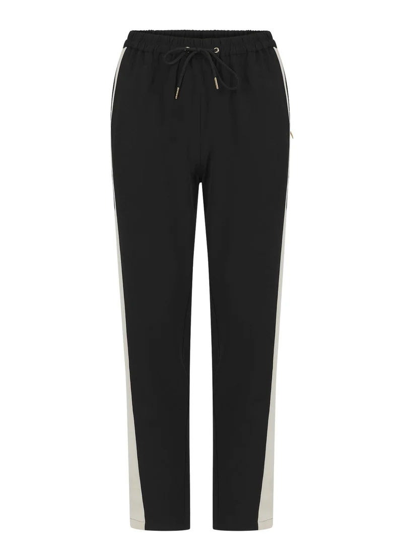 Jogging style sportif avec bandes latérales