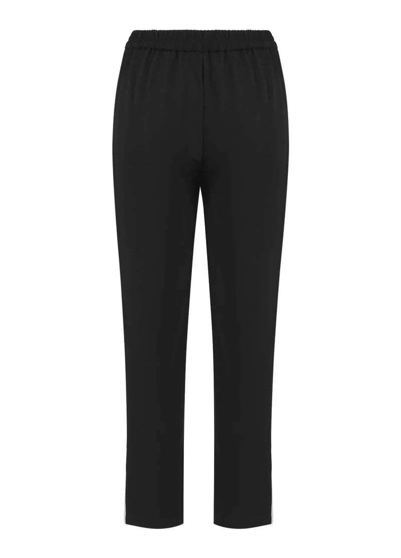Jogging style sportif avec bandes latérales
