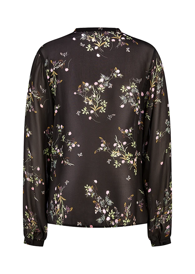 Blouse fleurie vaporeuse à col lacé
