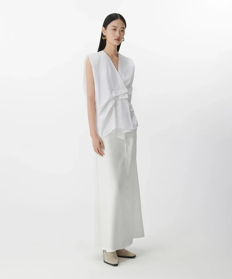 Blouse sans manches à plis asymétriques