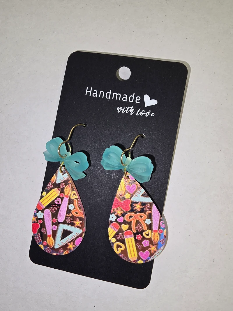 1042 His Spirit Creations School Spirit with a Bow on it Earrings