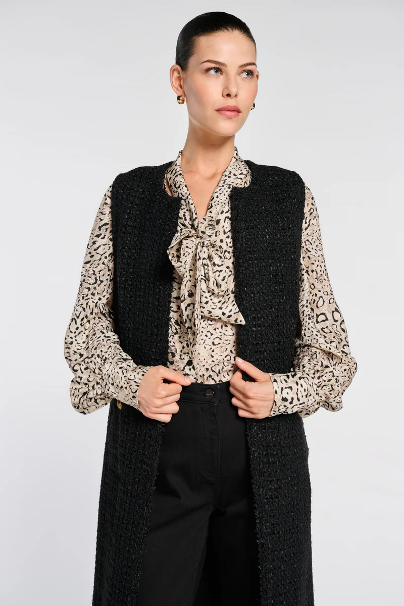 Veste longue sans manche en tweed