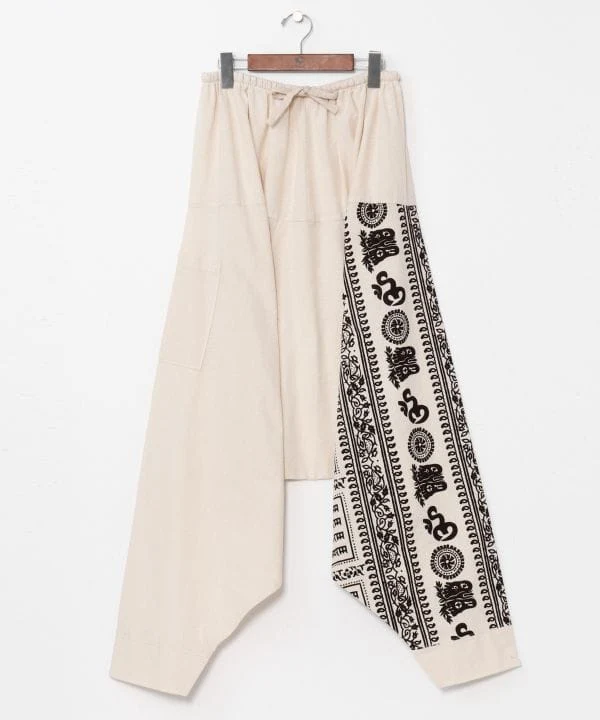 Pantalon harem à motif OM