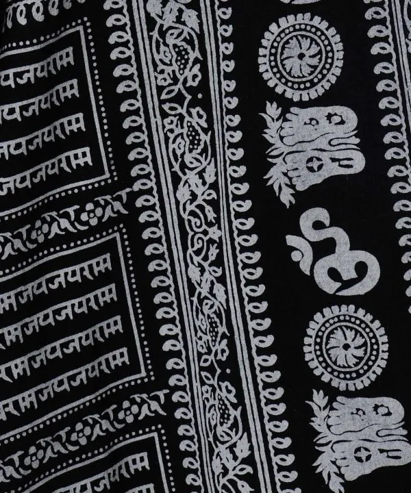 Pantalon harem à motif OM