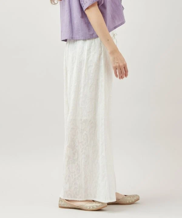 Pantalon évasé à motif jacquard floral