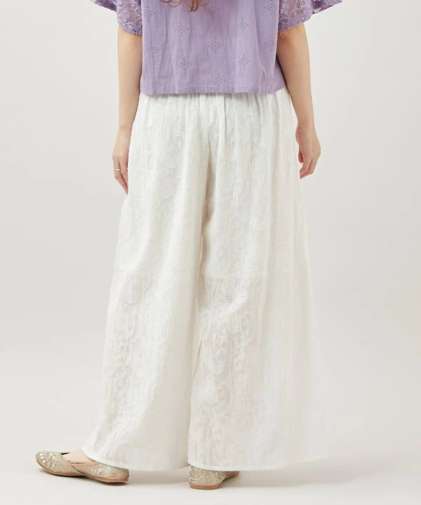 Pantalon évasé à motif jacquard floral