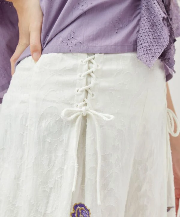 Pantalon évasé à motif jacquard floral